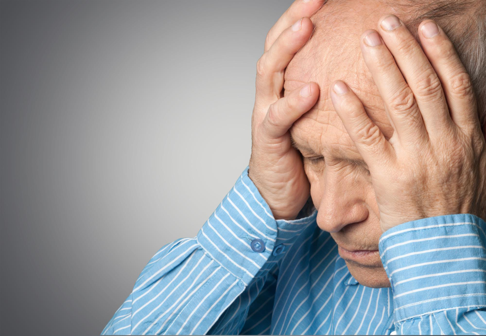 portrait-mature-man-holding-his-head-pain.jpg