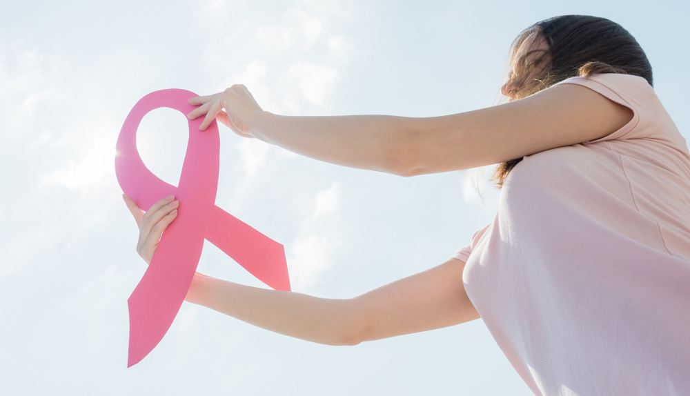 woman-showing-pink-ribbon-support-breast-cancer.jpg