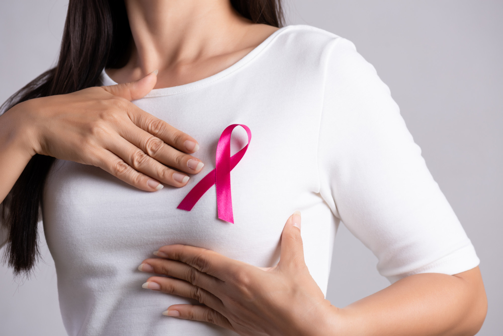 pink-badge-ribbon-woman-chest-support-breast-cancer-cause-healthcare.jpg