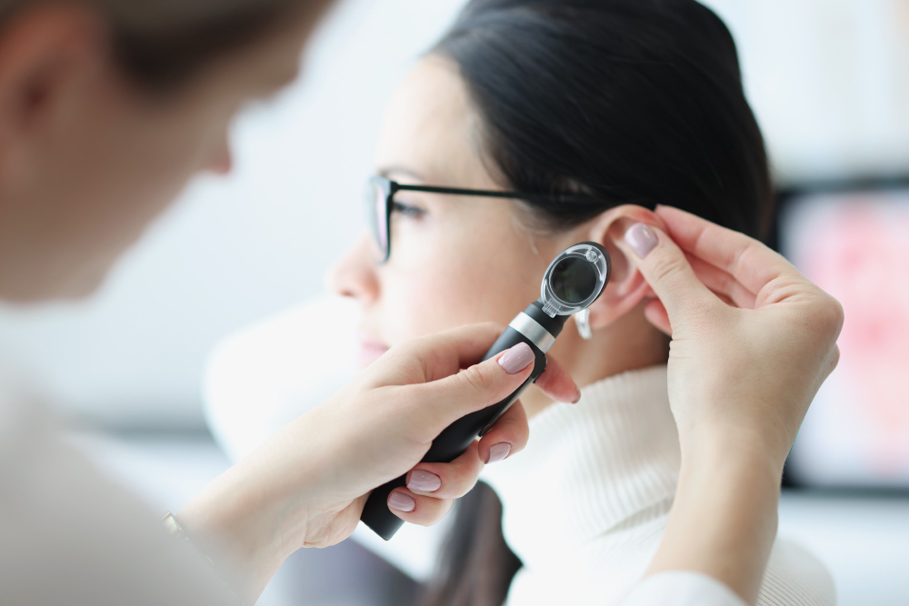 otorhinolaryngologist-examines-patient-ear-with-otoscope.jpg